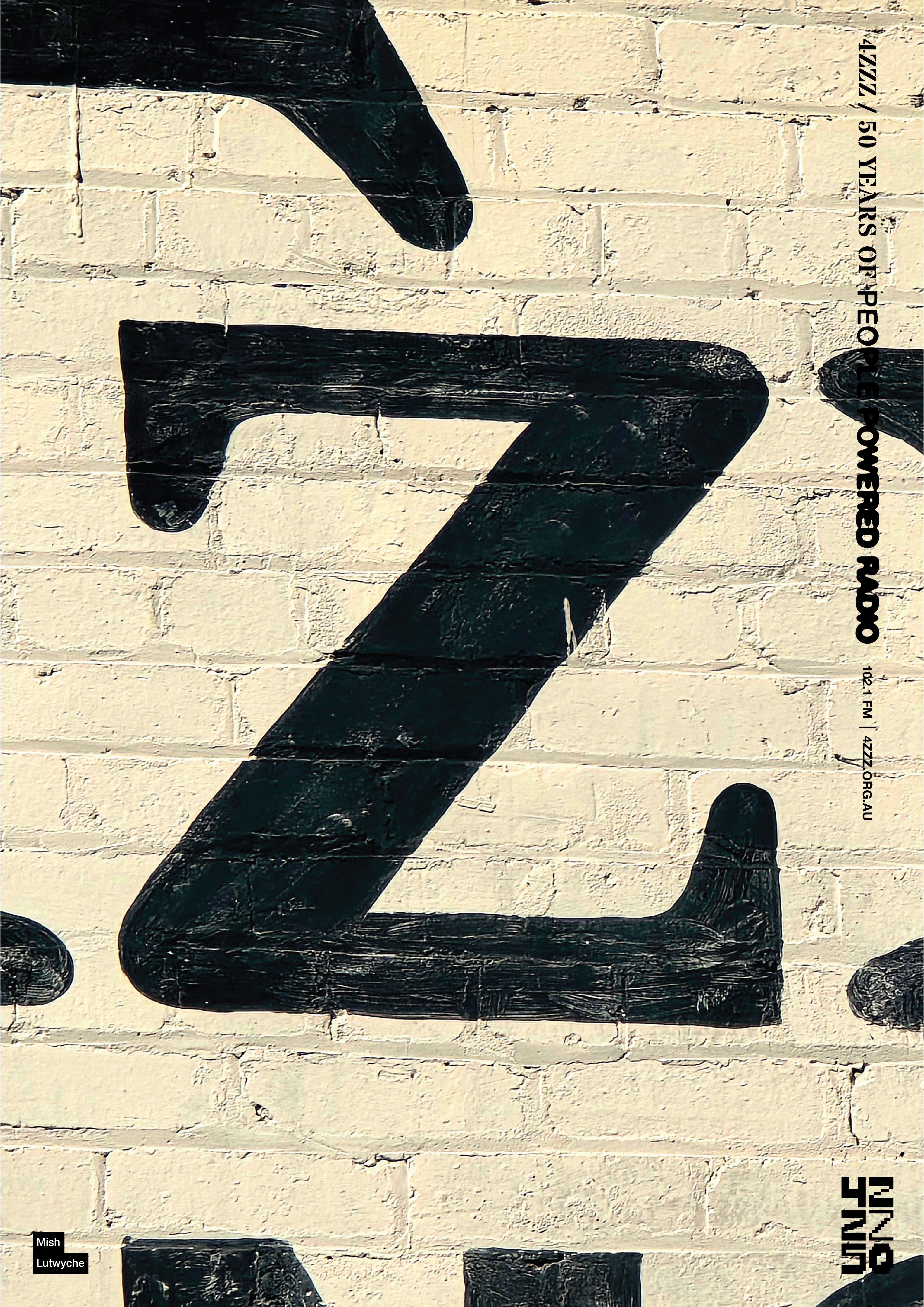 A black painting of a Z on a white painted brick wall. This particular Z is a photograph from the 'Album of the Year' wall at The Triffid. 