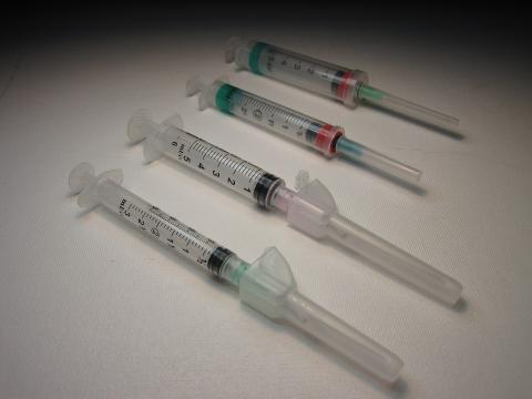 Image of four syringes.