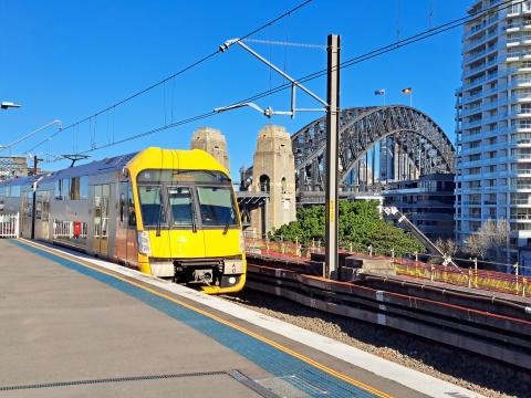 Image of a train with the Harbour Bridge in the background