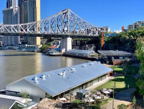 A view of the Howard Street Wharves looking over the Brisbane River and the Story Bridge.