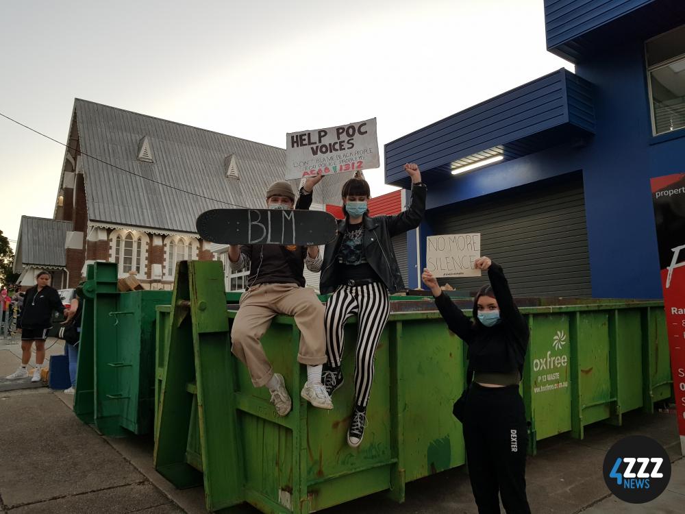 BLM Rally - Protesters showing off their signs at Musgrave Park [4ZZZ/Alexis Pink]