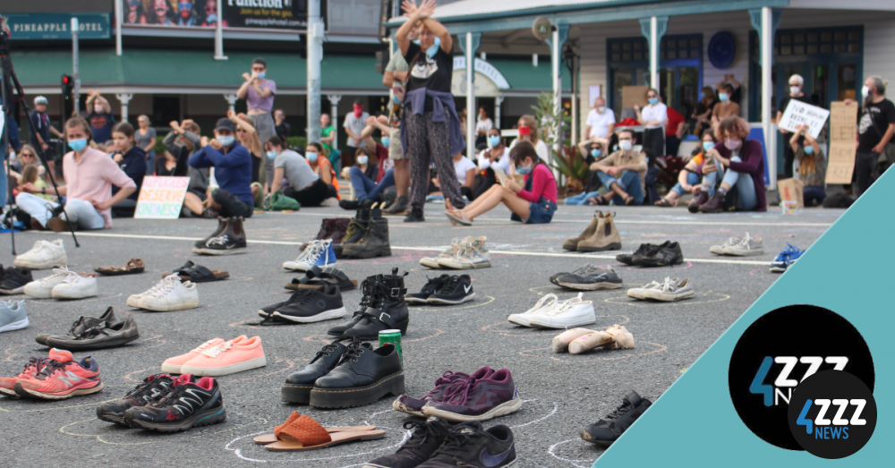 120 pairs of shoes laid out to represent the 120 detainees inside the Kangaroo Point detention centre. [4ZZZ/Lillian Rangiah]