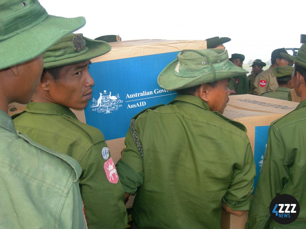 Soldiers move boxes of Australian aid in Myanmar