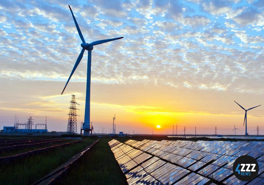 Image credit: Wikimedia Commons A field showcasing windmills and solar panels